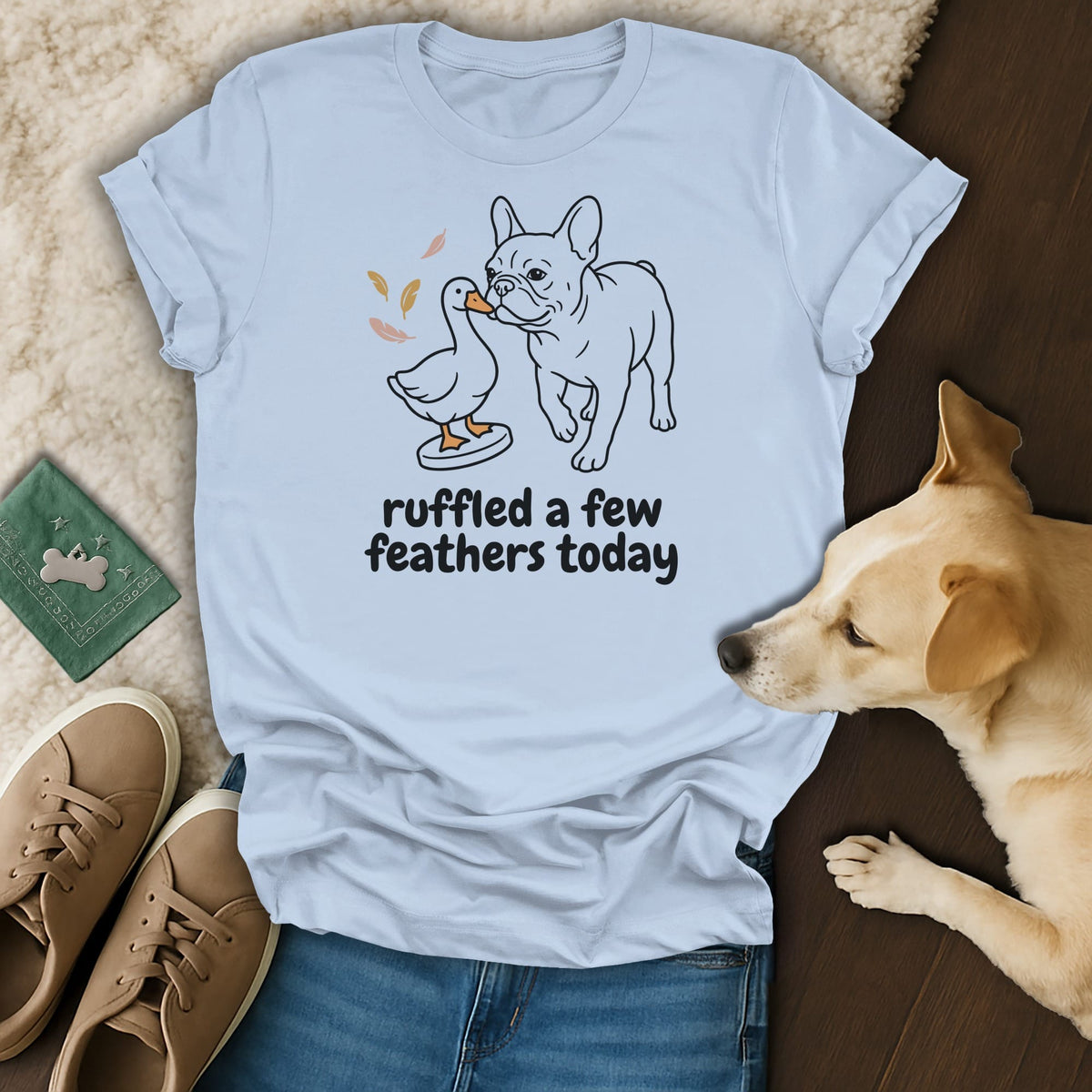 Light blue t-shirt with line drawing of French bulldog and duck, text "ruffled a few feathers today."