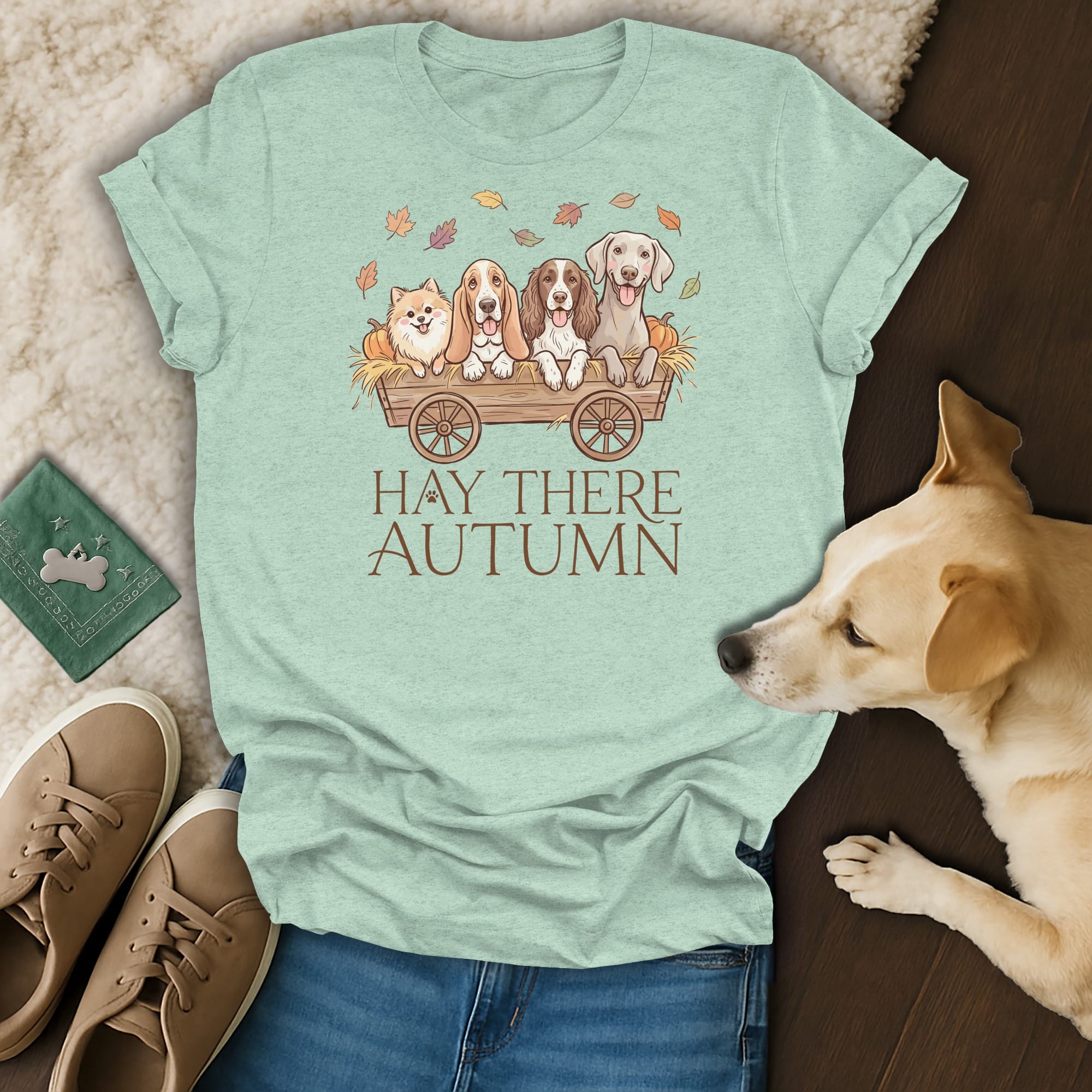 T-shirt with four dogs in a wagon, autumn leaves, and "Hay There Autumn" text.