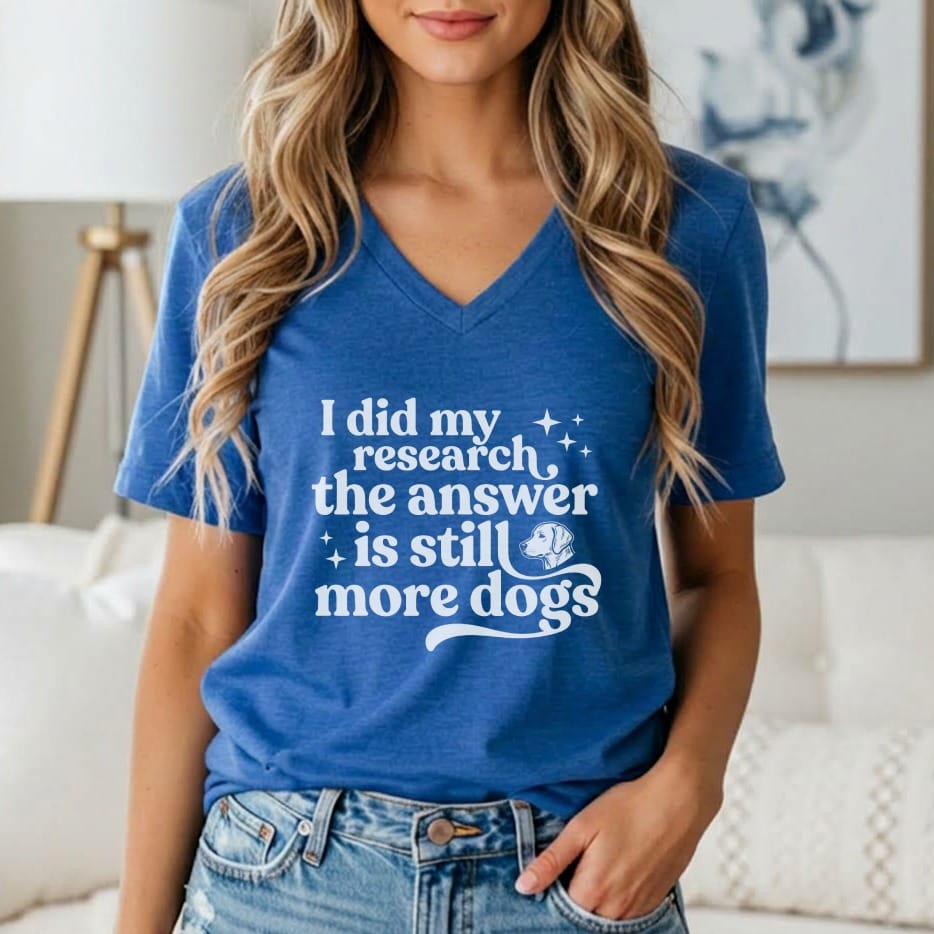 Blue v-neck t-shirt with white text "I did my research, the answer is still more dogs."