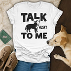 White t-shirt with "Talk Husky To Me" text and a howling husky illustration.