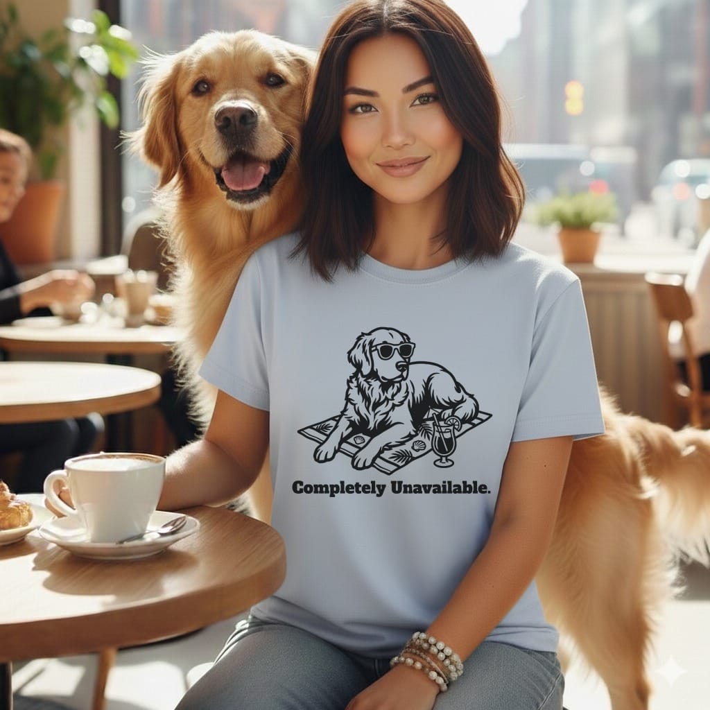 Woman with golden retriever wearing sunglasses and t-shirt reading "Completely Unavailable."