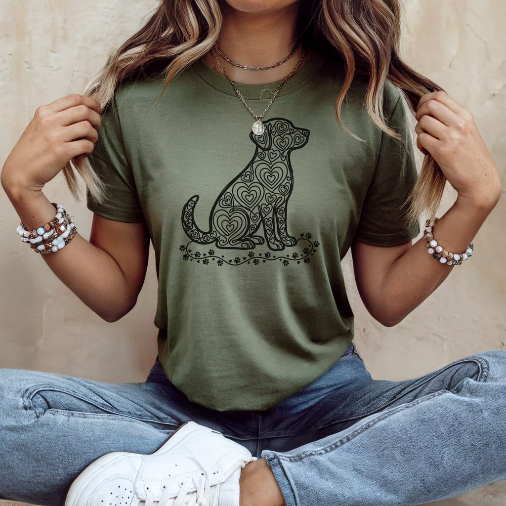 Green t-shirt with a heart-patterned dog silhouette and floral accents.