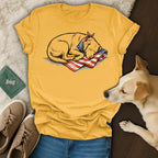 Yellow t-shirt with a sleeping dog wearing a bandana on an American flag.