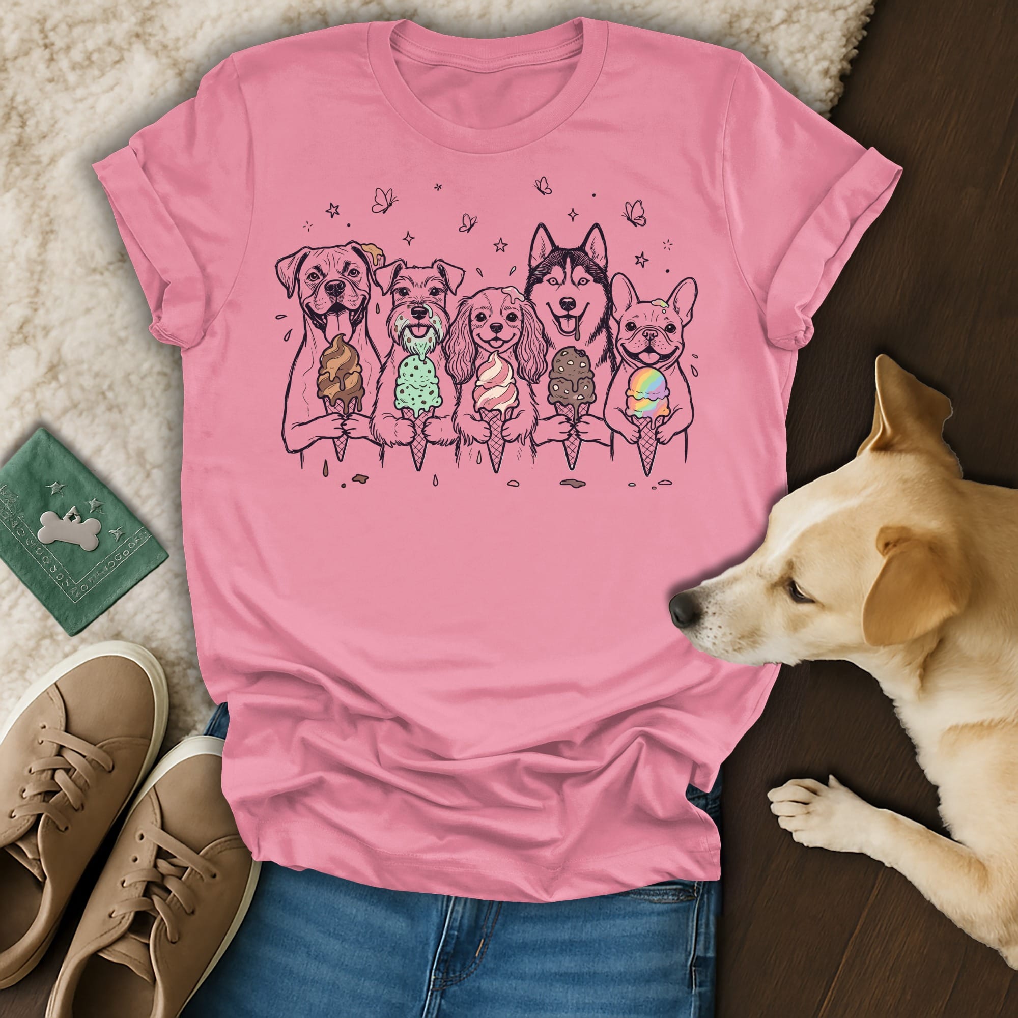 Five dogs in a line holding ice cream cones, on a pink t-shirt.
