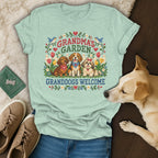 Mint green t-shirt featuring a cross-stitch graphic of three dogs and the text "Grandma's Garden Granddogs Welcome".