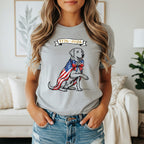 Labrador wearing a US flag cape and bowtie, with "250" and "1776-2026".