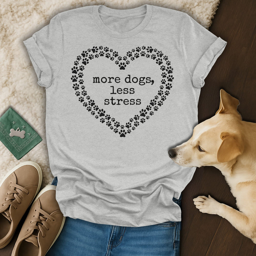 Gray t-shirt with a heart-shaped paw print border and text "more dogs, less stress".