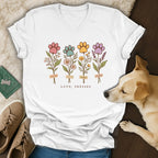 White V-neck t-shirt with four floral paw print stems and the text Love, Pressed.