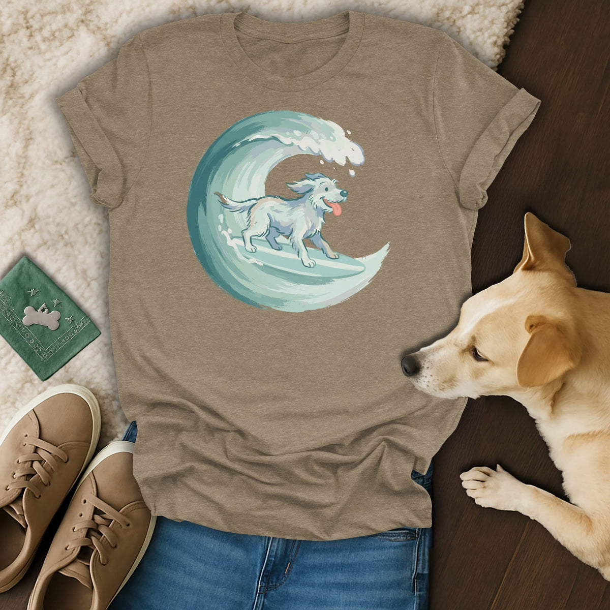 T-shirt with a white dog surfing on a teal wave graphic.