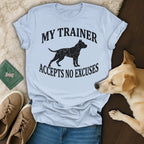 Light blue t-shirt with distressed dog graphic and text "My Trainer Accepts No Excuses."