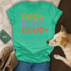 Green t-shirt with "Dog is My Love Language" text and dog partially visible.
