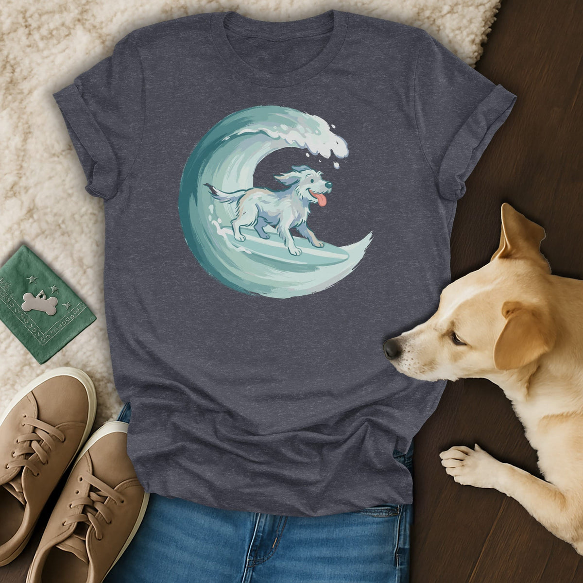 Dark grey t-shirt with a white dog surfing on a blue wave graphic.