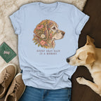 Light blue t-shirt featuring a golden retriever illustration with flowers and the text every gray hair is a memory.