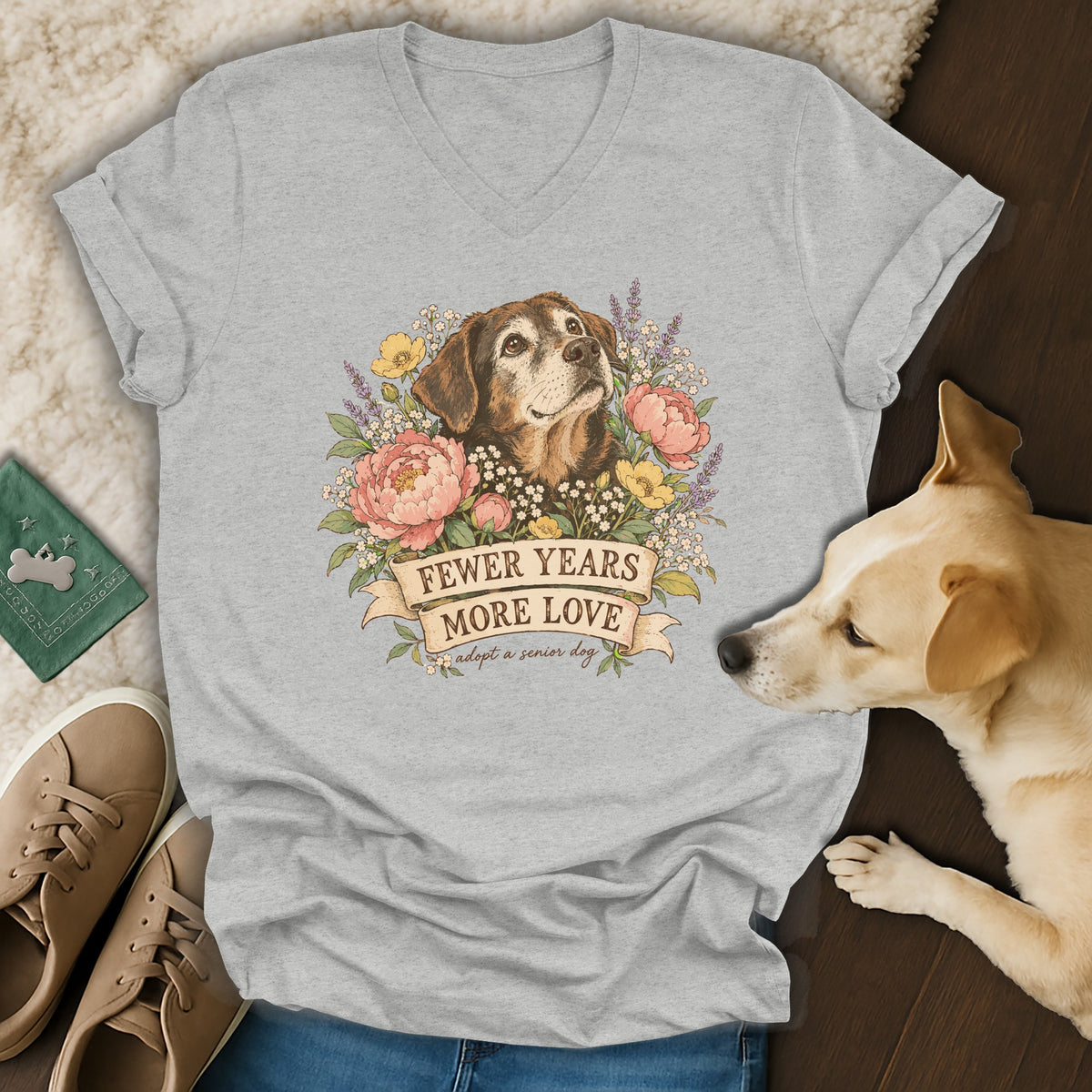 Heather gray V-neck T-shirt featuring a vintage illustration of a senior dog, flowers, and the text fewer years more love.