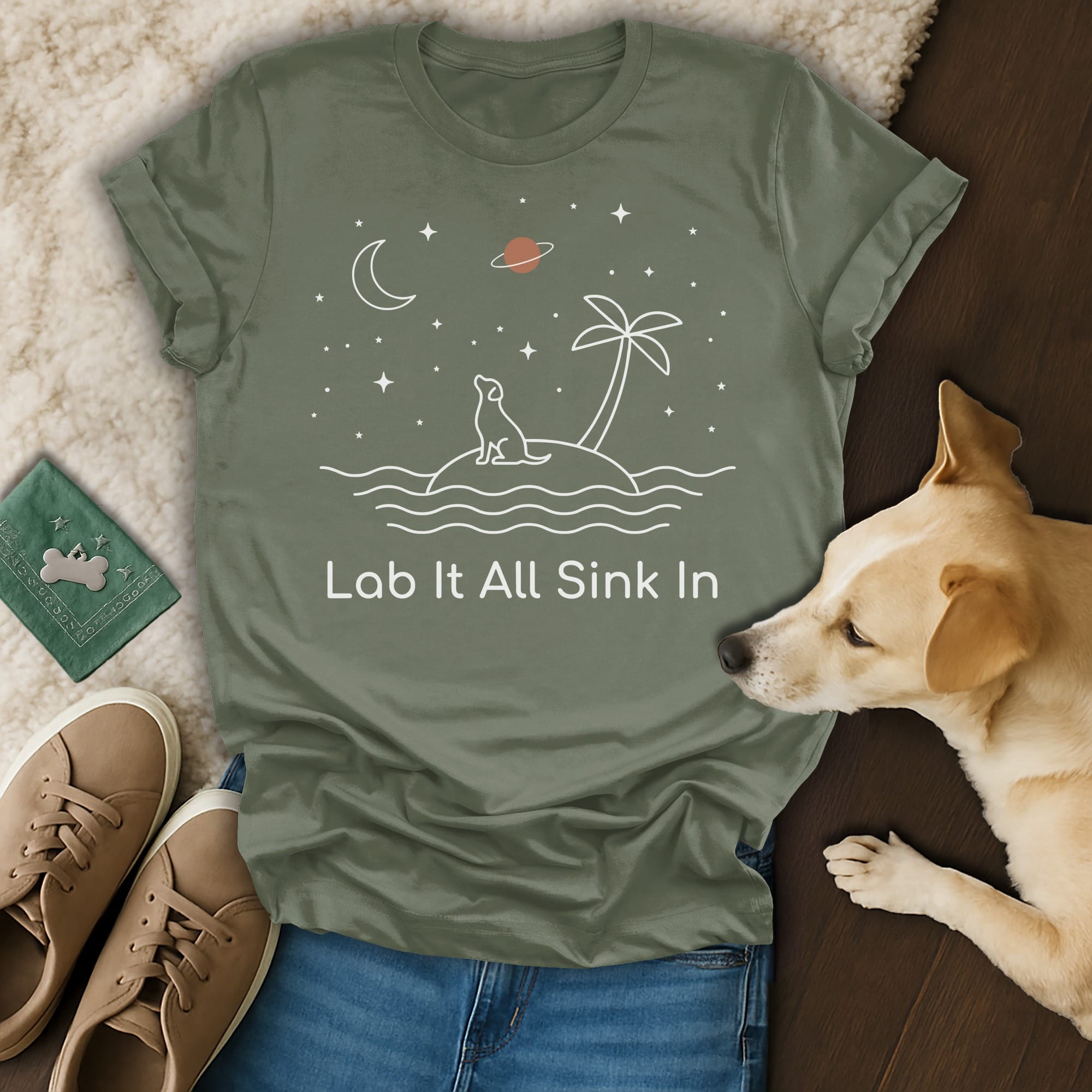 T-shirt with dog on island, palm tree, moon, and stars, text: Lab It All Sink In.