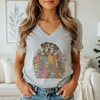 A woman wearing a heather gray V-neck t-shirt with a vintage dog illustration and the text ADOPT THE GRAY FACE.