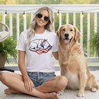 Woman and golden retriever wearing patriotic t-shirt with flag and bandana.