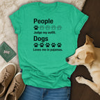 Green t-shirt with text "People Judge my outfit. Dogs Loves me in pajamas."