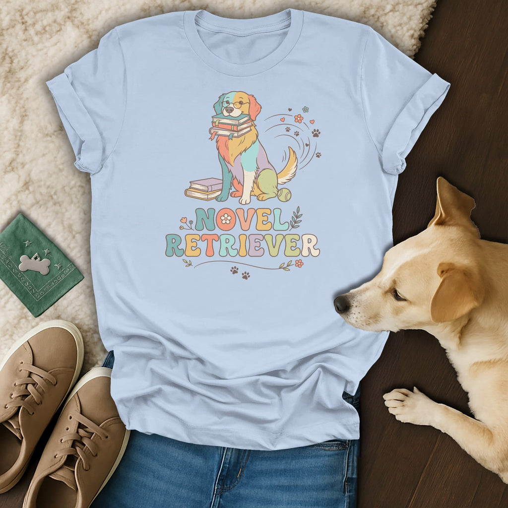 Light blue t-shirt with "Novel Retriever" text and colorful dog graphic.