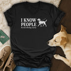 Black v-neck t-shirt with "I Know People" and a dog graphic.