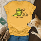 Yellow t-shirt with dog and tennis balls, "40 - Love" text.