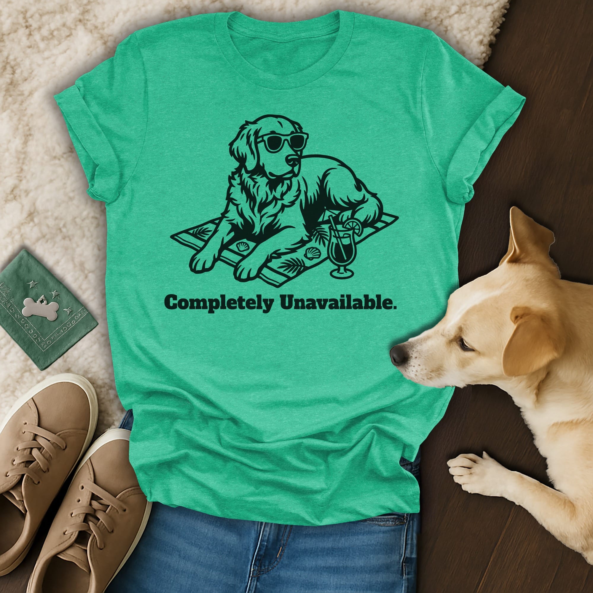 T-shirt with a black line drawing of a dog wearing sunglasses on a beach towel, with text.
