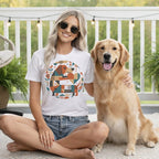 Woman with Golden Retriever wearing a white t-shirt with geometric dog heart graphic.