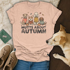 Peach t-shirt with graphic of four dogs and text "MUTTS ABOUT AUTUMN".
