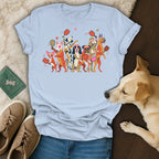 T-shirt with cartoon dogs playing pickleball and a live dog lying on the side.