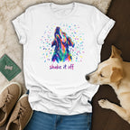 White t-shirt with colorful abstract dog head and "shake it off" text.