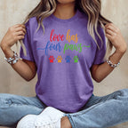 Purple t-shirt with "love has four paws" and paw prints.