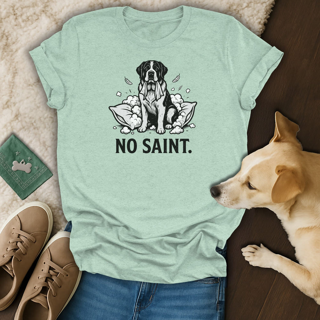 Mint green t-shirt with graphic of dog on pillow and text "NO SAINT."