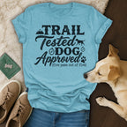 Light blue t-shirt with "TRAIL Tested DOG APPROVED (five paws out of five)" text.