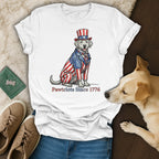 Dog wearing patriotic suit and hat with text "Pawtriots Since 1776".