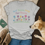 Gray t-shirt with "April Showers Bring Paw Flowers" text and floral paw print design.