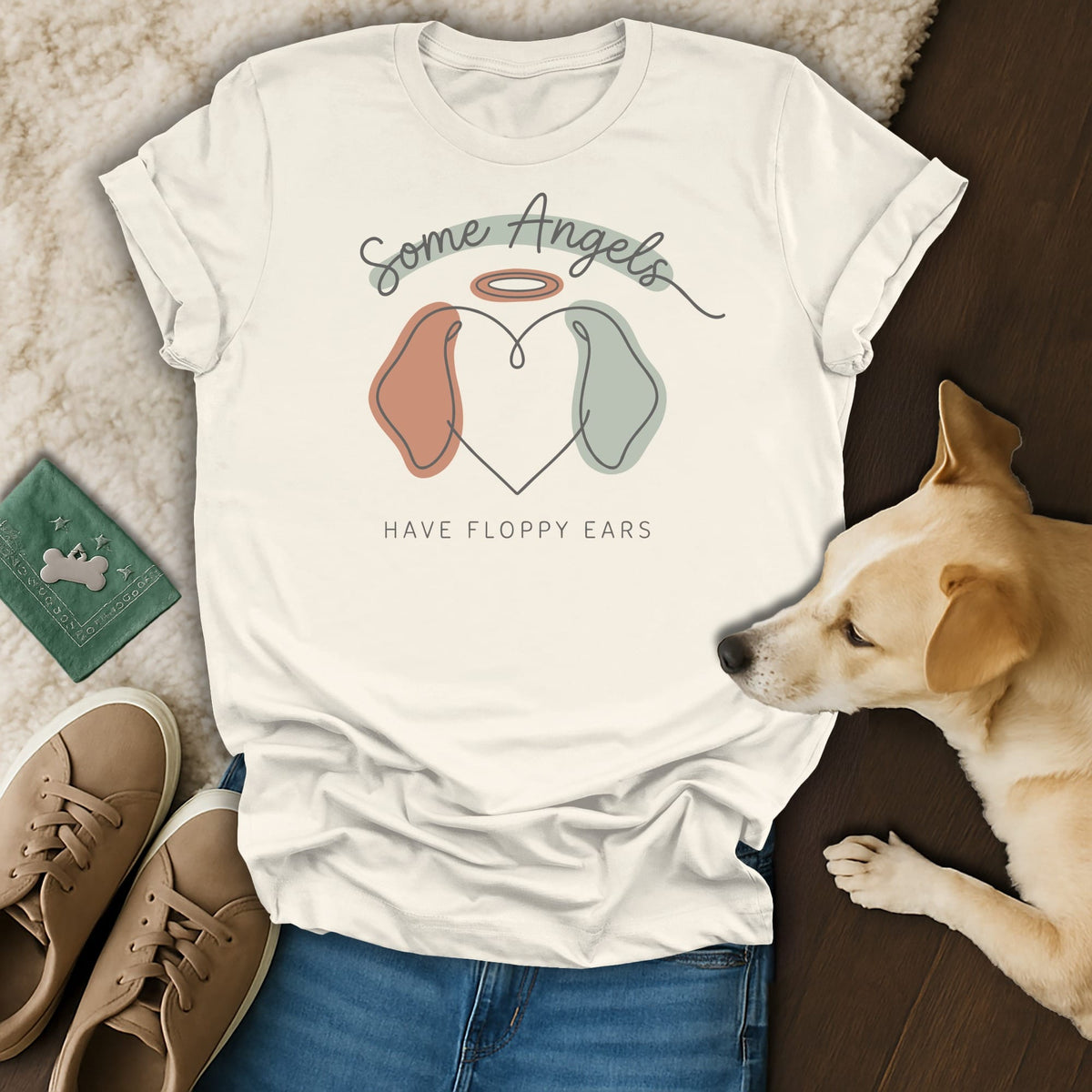 Cream t-shirt with text "Some Angels Have Floppy Ears" and dog ear graphic.