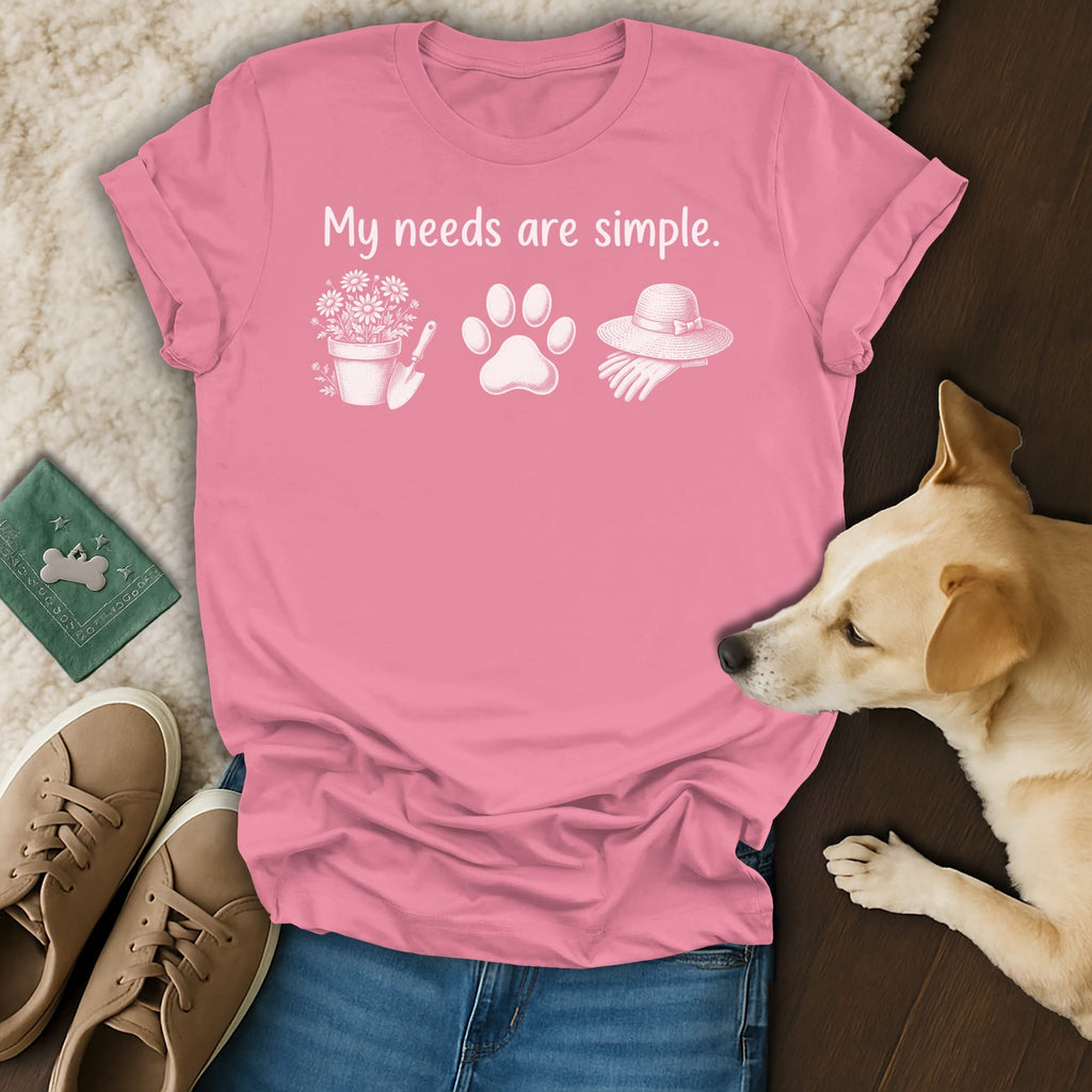 Pink t-shirt with "My needs are simple." text, flower pot, paw print, and hat.