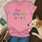 Pink t-shirt with "love has four paws" and colorful paw prints.