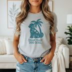 Light grey t-shirt with a teal doodle of a dog and palm tree, text reads "Island Heart DOG SOUL".