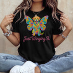 Colorful Geometric Winged Dog Just Winging It product type
Dog graphic
Butterfly dog
Geometric design
Colorful apparel
Vibrant print
Abstract animal
Labrador art
Just Winging It
Cute dog shirt
Pet owner gift
Unique artwork
Whimsical design
Animal lover
Statement tee
Artistic print
Rainbow dog
Funny graphic
Dog with wings
Creative design
Canine art
