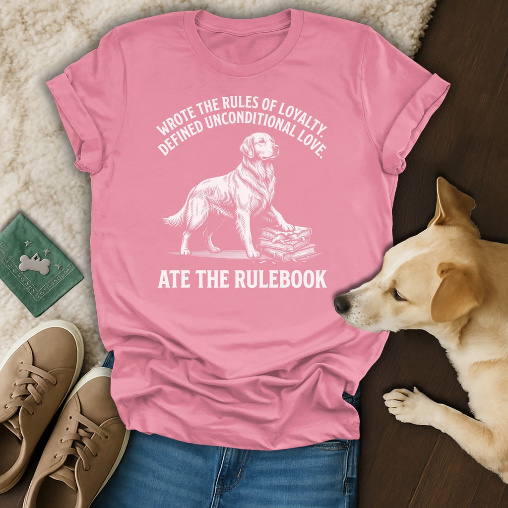 Pink t-shirt with white text and dog illustration: "Wrote the rules of loyalty, defined unconditional love. Ate the rulebook."