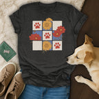 Dark grey t-shirt with a grid design of paw prints and flowers.