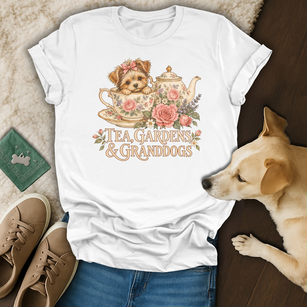 White t-shirt printed with a puppy in a teacup graphic, surrounded by roses, a teapot, and the text "Tea, Gardens & Granddogs".