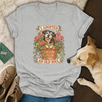 A heather gray v-neck t-shirt featuring a floral pot graphic with the text "I ADOPTED AN OLD SOUL."