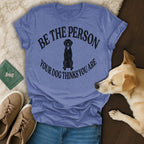 Blue t-shirt with black dog graphic and text "BE THE PERSON YOUR DOG THINKS YOU ARE".