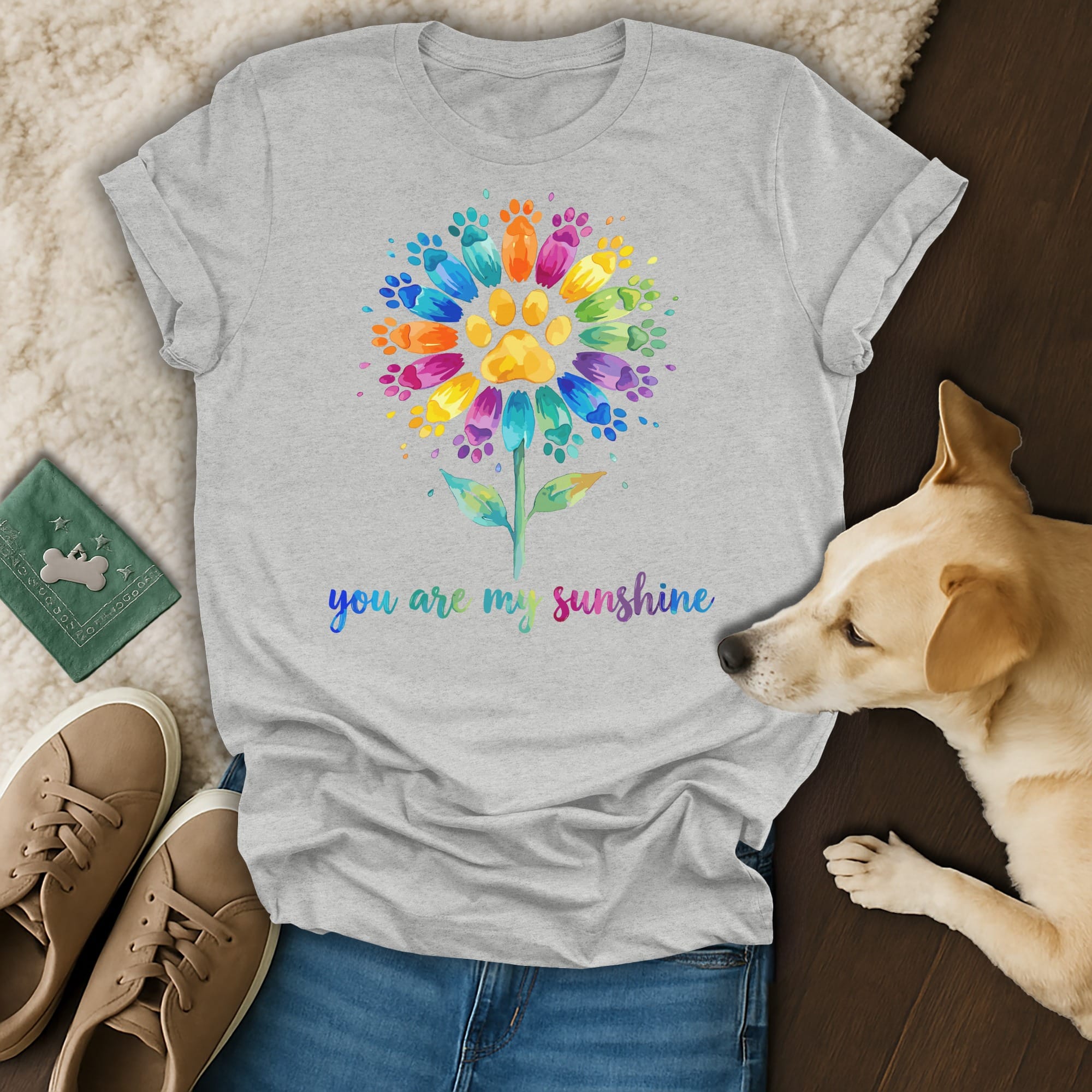 Grey t-shirt with colorful paw print flower and "you are my sunshine" text.