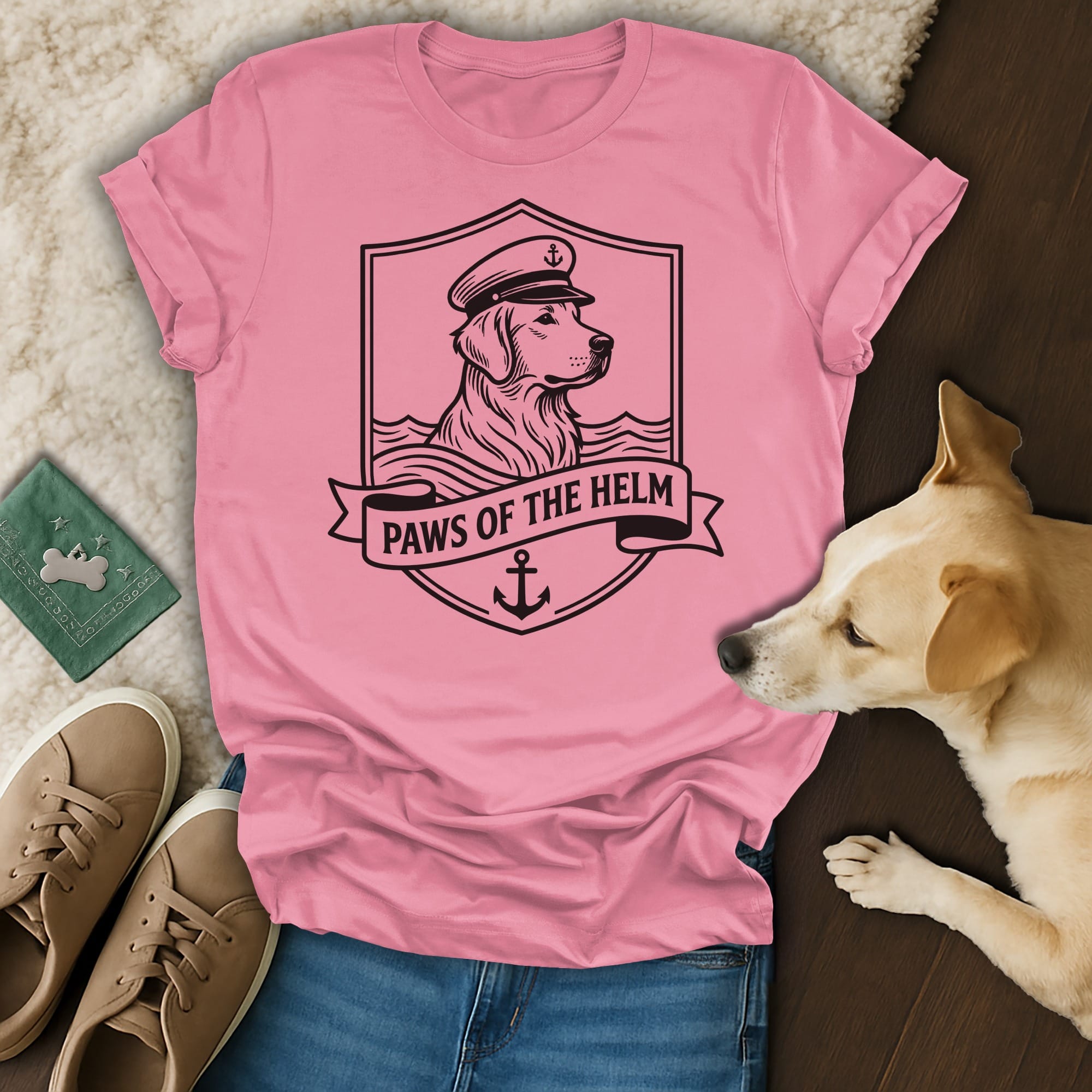 Pink t-shirt with a golden retriever wearing a captain's hat and the text "Paws of the Helm".