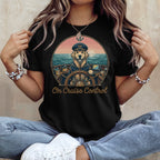 Black t-shirt with a cartoon dog captain steering a boat, sunset scene, "On Cruise Control" text.