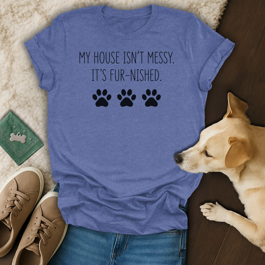 Blue t-shirt with "My house isn't messy. It's fur-nished." text and paw prints.