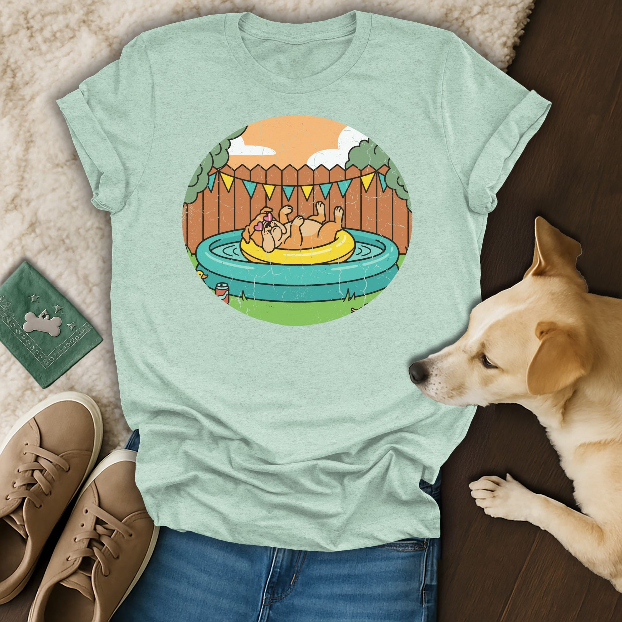 Dog lounging in a kiddie pool on an inflatable ring, wearing a bandana.